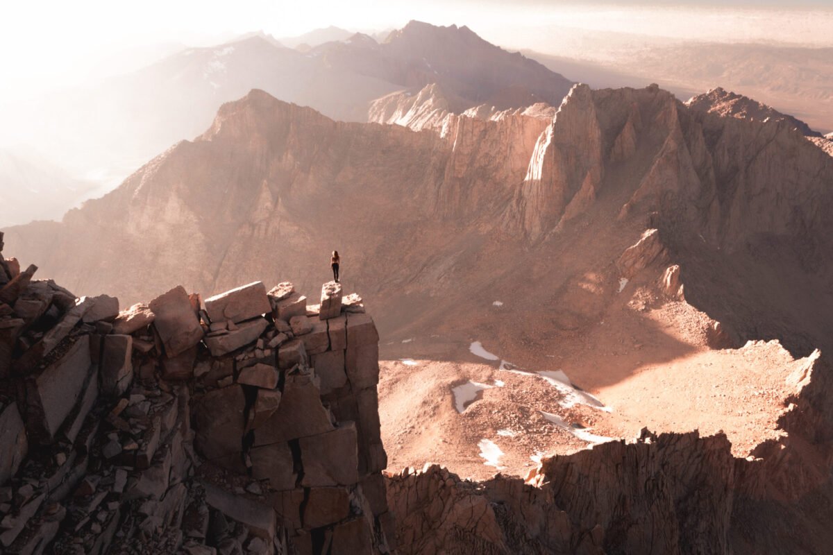 A photo of Chelsea at the summit of Mount Whitney, in a blog about the best 3 off-trail hikes