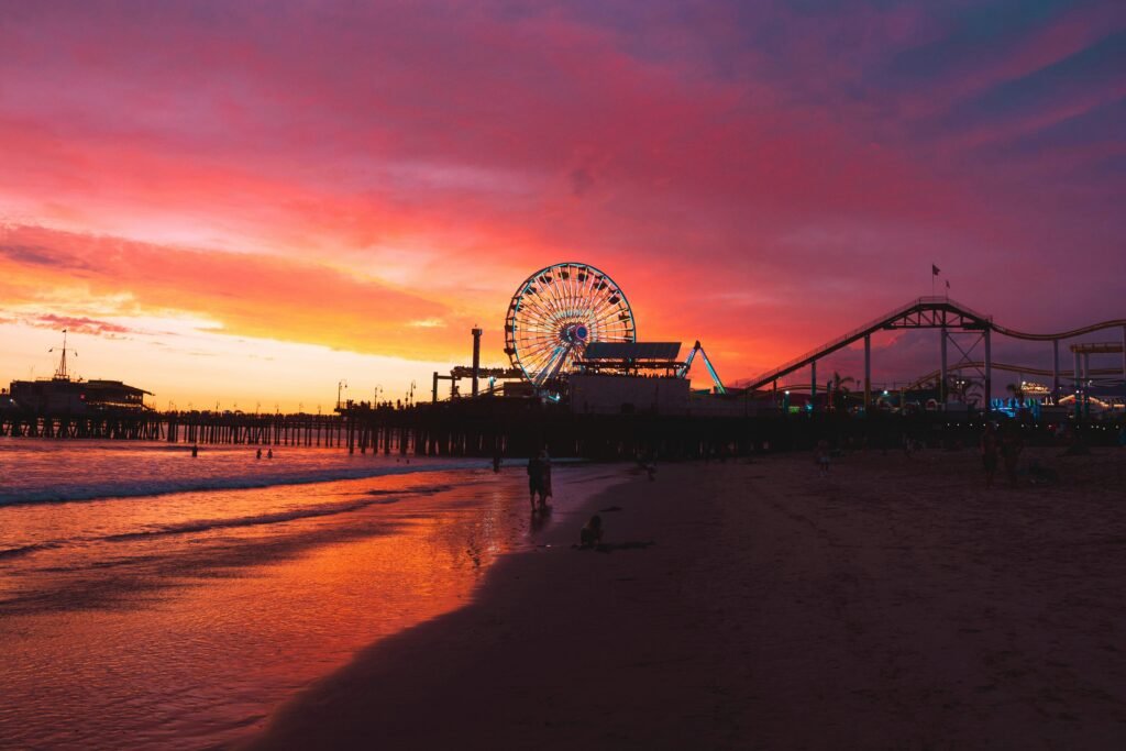 pexels-photo-18180066-18180066 Breathtaking sunset over Santa Monica Pier with illuminated Ferris wheel and vibrant skies.