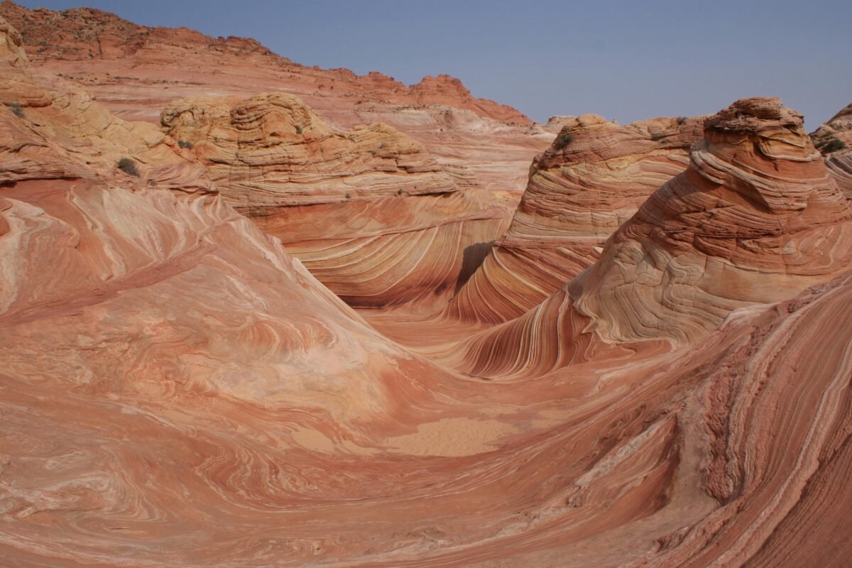 Beautiful sandstone formations at The Wave in Utah's Kanab region with clear skies.