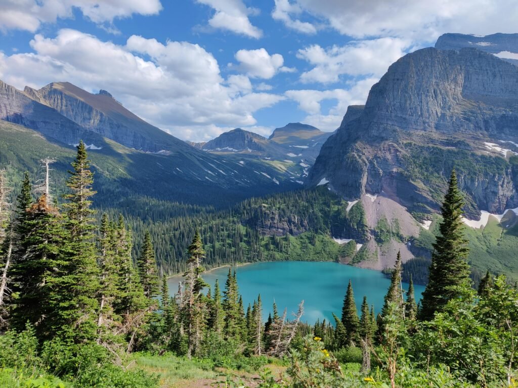 pexels-photo-22718140-22718140 Breathtaking view of a mountain lake surrounded by forest in Glacier National Park, Montana.