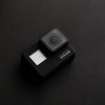 pexels-photo-2294897-2294897 High-quality image of a GoPro camera on a dark surface, ideal for tech content.