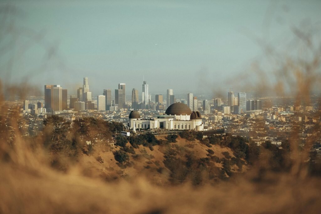 pexels-photo-2709964-2709964 The Griffith Observatory with Los Angeles skyline backdrop at sunset, showcasing urban architecture.