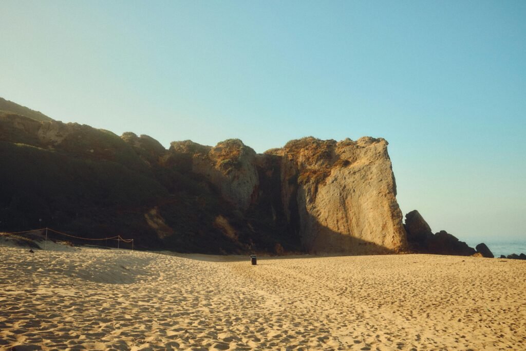 pexels-photo-31353939-31353939 A beautiful scenic view of the sandy beach and iconic cliffs of Point Dume in Malibu, California.