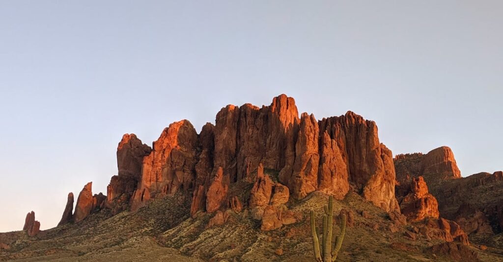 pexels-photo-3868543-3868543 Beautiful sunset view of the Superstition Mountains in Arizona with towering cacti.