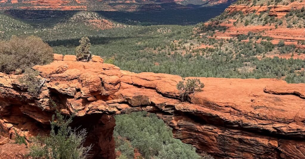 Breathtaking view of the iconic Devil's Bridge with red rock formations under a clear blue sky.