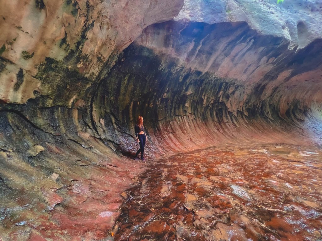 An image of me standing within the walls of The Subway in Zion National Park Wilderness